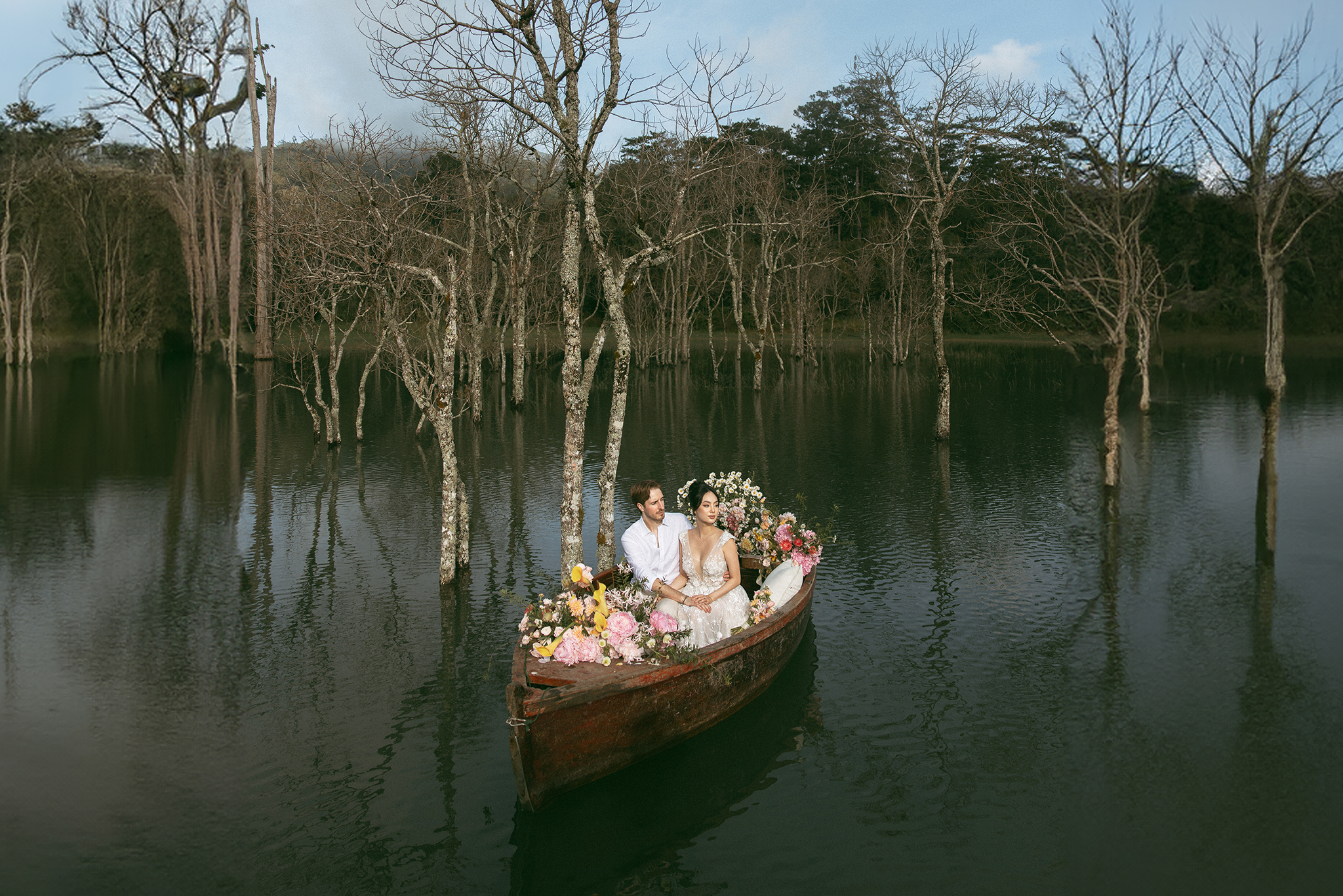 Vietnam misty lake pre-wedding boat scene
